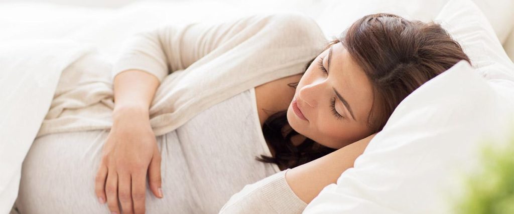 Pregnant women is trying to sleep