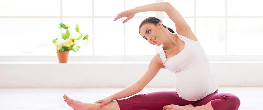 Pregnant women doing yoga for good skin